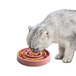 Pink slow feeder bowl with dry pet food inside